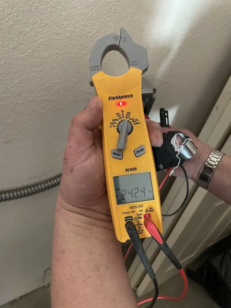 Voltage testing with clamp meter during Whole House Surge Protector in Borger